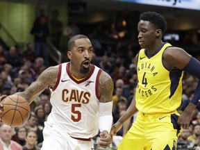 Cleveland Cavaliers' JR Smith (5) drives against Indiana Pacers' Victor Oladipo (4) during the first half of an NBA basketball game Friday, Jan. 26, 2018, in Cleveland.