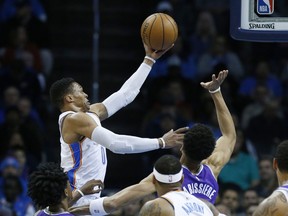 Oklahoma City Thunder guard Russell Westbrook, left, shoots in front of Sacramento Kings forward Skal Labissiere, right, in the first quarter of an NBA basketball game in Oklahoma City, Monday, Jan. 15, 2018.