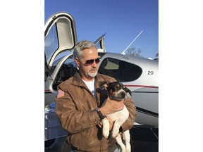 In this undated photo provided by Rachelle Hurd, Dr. Bill Kinsinger is pictured at the Russellville Arkansas airport in Little Rock, Arkansas. Kinsinger who volunteering for a dog rescue operation failed to land his small plane at an airport in Central Texas as planned and was later tracked by fighter jets flying over the Gulf of Mexico appeared unresponsive and may have been suffering from a lack of oxygen, officials said Thursday, Jan. 4, 2018.
