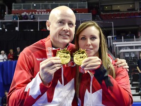 Canadian Olympic skips Kevin Koe and Rachel Homan celebrate their wins at the Roar of the Rings Olympic Curling Trials in Ottawa on Dec. 10, 2017.