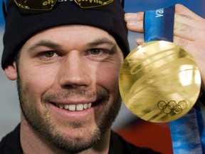 In this March 1, 2010 file photo, Canadian snowboarder Jasey-Jay Anderson holds his gold medal from the Vancouver Olympics.