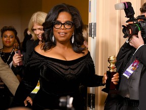 Oprah Winfrey arrives with the Cecil B. DeMille Award in the press room during The 75th Annual Golden Globe Awards on Jan. 7, 2018, in Beverly Hills.