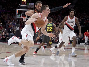 Portland Trail Blazers guard Pat Connaughton, front, dribbles past Atlanta Hawks guard Marco Belinelli during the first half of an NBA basketball game in Portland, Ore., Friday, Jan. 5, 2018.