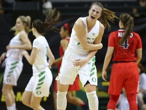 FLE - In this Jan. 12, 2018, file photo, Oregon's Sabrina Ionescu celebrates the first of her four 3-pointers against Arizona during an NCAA college basketball game in Eugene, Ore. Oregon's Ionescu has gained attention with her triple-double record. But she's much more than a stat to the No. 7 Ducks, who are off to a 6-0 start in Pac-12 conference play.