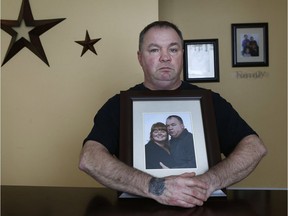 Robert Cadieux holds a photo of his wife Kristine in his house in Cornwall. Robert lost his wife Kristine in a June 2017 crash on Highway 401.
