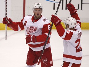 Detroit Red Wings' Justin Abdelkader (8) celebrates his goal with Tomas Tatar (21) in the first period of an NHL hockey game against the Pittsburgh Penguins in Pittsburgh, Saturday, Jan. 13, 2018.