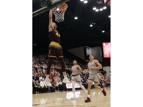 Arizona State guard Kodi Justice, top left, dunks against Stanford during the first half of an NCAA college basketball game Wednesday, Jan. 17, 2018, in Stanford, Calif.