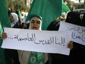 Palestinian women take part in a protest in Gaza City on January 22, against the decision to recognize Jerusalem as the capital of Israel and to freeze tens of millions of dollars in contributions to the United Nations Relief and Work Agency (UNRWA).