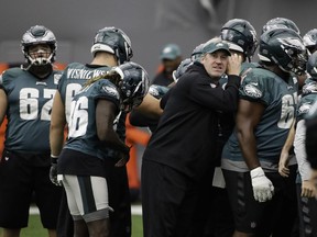 Philadelphia Eagles head coach Doug Pederson huddles with the team during practice at the team's NFL football training facility in Philadelphia, Friday, Jan. 26, 2018. The Eagles face the New England Patriots in Super Bowl 52 on Sunday, Feb. 4, in Minneapolis.