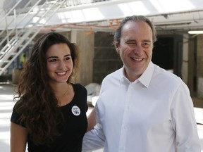 FILE - In this Aug.25, 2016 file photo, Director of Station F, USA's Roxanne Varza, left, and founder of Station F, French telecom tycoon Xavier Niel, right, pose during a event at Station F. For a glimpse at President Emmanuel Macron's vision for the new French economy, look no farther than Station F. Entrepreneurs don virtual reality goggles and share ideas with business angels in this old Paris train station-turned-startup incubator.
