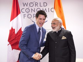 Prime Minister Justin Trudeau greets Indian Prime Minister Narendra Modi on Tuesday, Jan. 23, 2018, in Davos, Switzerland, at the World Economic Forum.
