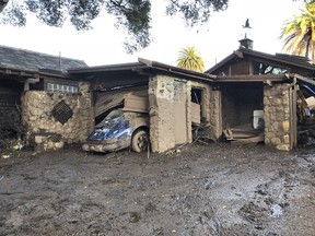 FILE--This Jan. 10, 2018, file photo provided by the Santa Barbara County Fire Department shows damage from mud, boulders, and debris that destroyed homes that lined Montecito Creek near East Valley Road in Montecito, Calif. Authorities say they hope to start allowing residents to return Jan. 31, 2018, to Southern California neighborhoods devastated by mudslides -- if they can get most utilities restored by then.