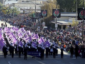 FILE--In this Jan. 1, 2015, file photo, Blue Springs High School band "The Golden Regiment" performs in the 126th Rose Parade in Pasadena, Calif. Only a few clouds are expected Monday, Jan. 1, 2018, in Pasadena as the city plans to celebrate the 129th Rose Parade, and temperatures are expected to be in the mid-70s.