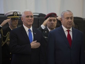 U.S Vice-President Mike Pence (L) is seen with Israeli Prime Minister Benjamin Netanyahu (R) during an official welcome ceremony at the Prime Minister's Office in Jerusalem, Israel. The vice president landed in Israel Sunday evening after visiting  Egypt and Jordan.