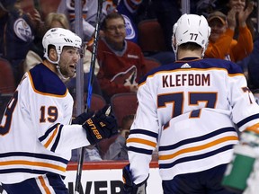 Edmonton Oilers left wing Patrick Maroon (19) celebrates his goal against the Arizona Coyotes with defenseman Oscar Klefbom (77) during the first period of an NHL hockey game, Friday, Jan. 12, 2018, in Glendale, Ariz.