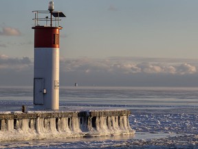 Ice glistens in the late afternoon sun at Port Dover, Ont., on Lake Erie on Jan. 6, 2018.