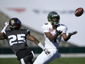 American team's Marquez Valdes-Scantling, of South Florida, catches a pass as National team's Henre' Toliver, of Arkansas, defends during the first half of the Collegiate Bowl college football game, Saturday, Jan. 20, 2018, in Pasadena, Calif.