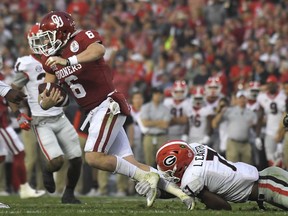 Oklahoma quarterback Baker Mayfield (6) is sacked by Georgia linebacker Lorenzo Carter, right, during the second half of the Rose Bowl NCAA college football game, Monday, Jan. 1, 2018, in Pasadena, Calif.