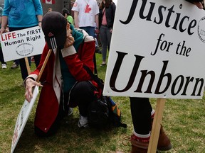 People take part in the "March For Life" on Parliament Hill on May 8, 2014.
