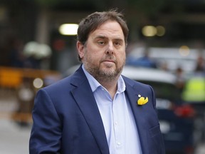 FILE - In this Nov. 2, 2017, file photo, the sacked Catalan Vice President Oriol Junqueras arrives at the National Court for questioning by a National Court judge investigating possible rebellion charges, in Madrid, Spain. A Spanish court on Thursday Jan. 4, 2018 is reviewing an appeal by Junqueras against his imprisonment as he awaits formal charges over possible rebellion, sedition and embezzlement in the restive region's recent drive for independence from Spain.