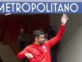 Diego Costa waves to fans during his official presentation for Atletico Madrid at the Wanda Metropolitano stadium in Madrid, Spain, Sunday, Dec. 31, 2017. Costa was signed from Chelsea earlier in 2017 but was not eligible to play until 2018.