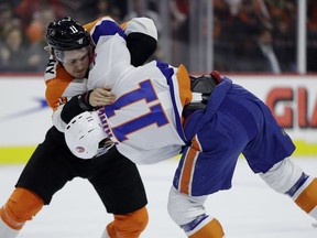 Philadelphia Flyers' Travis Konecny, left, and New York Islanders' Shane Prince fight during the first period of an NHL hockey game, Thursday, Jan. 4, 2018, in Philadelphia.