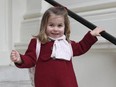 In this handout picture provided by the Duke and Duchess of Cambridge, Britain's Princess Charlotte smiles as she prepares for her first day of nursery at the Willcocks Nursery School, in London, Monday, Jan. 8, 2018. (Duchess of Cambridge via AP)