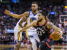 Raptors guard Fred VanVleet keeps in front of Golden State Warriors guard Stephen Curry during game at the Air Canada Centre in Toronto on Saturday.
