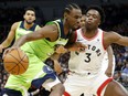 Andrew Wiggins, of the Timberwolves drives around Toronto Raptors' OG Anunoby in the first half of their game Saturday night in Minneapolis.