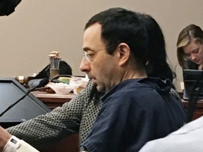 Former Michigan sports doctor Larry Nassar sits in court Tuesday, Jan. 16, 2018, in Lansing, Mich., at the start of his four-day sentencing hearing for sexually assaulting young gymnasts. Dozens of women and girls who were victims will be allowed to speak. Judge Rosemarie Aquilina is expected to order a sentence Friday, Jan. 19.