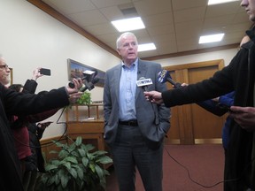 Milwaukee Mayor Tom Barrett speaks to reporters outside his office about the Red Cross asking fire victims in some parts of the city to come to them or a nearby police station on Tuesday, Jan. 2, 2018, in Milwaukee. The Red Cross Milwaukee chapter said the policy change is to address a volunteer shortage, but the move has sparked outrage because the areas affected are low-income and predominantly black and Latino.
