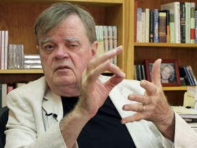 FILE - In this July 26, 2017, file photo, Garrison Keillor, creator and former host of, "A Prairie Home Companion," talks at his St. Paul, Minn., office. Keillor says he is in negotiations with Minnesota Public Radio after the radio network cut ties with him over unspecified allegations of inappropriate behavior. Keillor wrote on his Facebook page Friday, Jan. 5, 2018, that a second day of mediation was held at a law firm in downtown Minneapolis, but he provided no details.