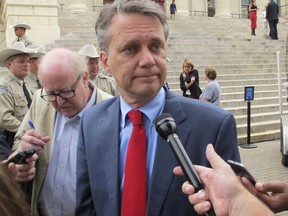 FILE - In this Sept. 27, 2017, file photo, Kansas Lt. Gov. Jeff Colyer speaks to reporters outside the Statehouse in Topeka, Kan. Colyer begins his tenure Wednesday, Jan. 31, 2018, as Kansas governor replacing Gov. Sam Brownback, his GOP predecessor who is stepping down to become U.S. ambassador-at-large for international religious freedom.