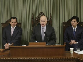 FILE - In this Jan. 24, 2017 file photo, California Gov. Jerry Brown delivers his annual State of the State address before a joint session of the California Legislature, in Sacramento, Calif. Brown will look back on his four terms as California's governor and lay out his vision for what's to come when he delivers his final State of the State address Thursday, Jan. 25, 2018. In the background are Assembly Speaker Anthony Rendon, D-Paramount, left, and Senate President Pro Tem Kevin de Leon, D-Los Angeles.