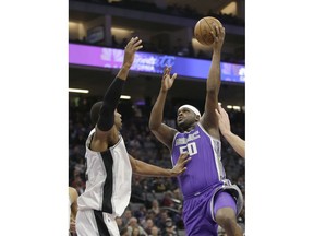 Sacramento Kings forward Zach Randolph, right, shoots over San Antonio Spurs forward LaMarcus Aldridge during the first quarter of an NBA basketball game Monday, Jan. 8, 2018, in Sacramento, Calif.