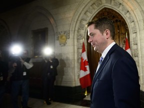 Conservative Leader Andrew Scheer speaks to media in the foyer of the House of Commons on Parliament Hill in Ottawa on Wednesday, Dec. 20, 2017.