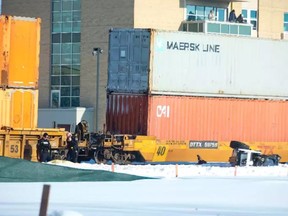 A freight train struck a sidewalk snowplow at the Colborne Street rail crossing in downtown London just before 10 a.m. Tuesday. One person was killed.