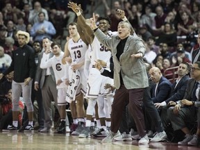 South Carolina head coach Frank Martin, right, communicates with players after a score during the first half of an NCAA college basketball game against Texas Tech, Saturday, Jan. 27, 2018, in Columbia, S.C.