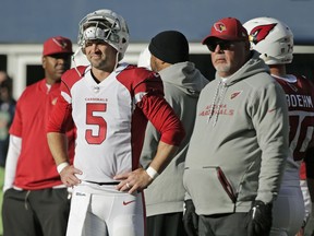 Arizona Cardinals quarterback Drew Stanton (5) stands with head coach Bruce Arians, right during warmups before an NFL football game against the Seattle Seahawks, Sunday, Dec. 31, 2017, in Seattle.