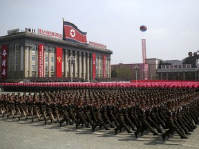 FILE - In this April 15, 2017, file photo, soldiers march across Kim Il Sung Square during a military parade in Pyongyang, North Korea. North Korea is preparing to stage a major event to mark the 70th anniversary of the founding of its military on Feb. 8, 2018 - just one day before the opening ceremony of the Pyeongchang Winter Olympics in South Korea.