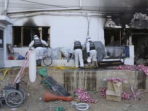 Police investigators inspect a burnt hospital after a fire in Miryang, South Korea, Saturday, Jan. 27, 2018. A fire raced through the small South Korean hospital with no sprinkler system on Friday, killing 37 people, many of them elderly, and injuring more than 140 others in the country's deadliest blaze in about a decade.