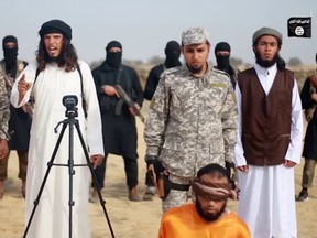 A still image from a new ISIL video in which an alleged Hamas collaborator is executed.