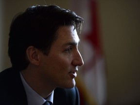 Prime Minister Justin Trudeau takes part in a round table discussion with