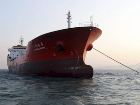 The Lighthouse Winmore, a Hong Kong-flagged ship, is seen in waters off Yeosu, South Korea, Friday, Dec. 29, 2017. South Korean authorities boarded the Hong Kong-flagged ship and interviewed its crew members for allegedly violating UN sanctions by transferring oil to a North Korean vessel in October.