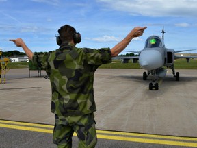 A JAS 39 Gripen aircraft takes off from Såtenäs air base, Sweden.