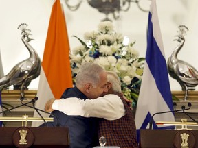 Israeli Prime Minister Benjamin Netanyahu, left, and India's Prime Minister Narendra Modi, hug each other during a joint media interaction in New Delhi, India, Monday, Jan.15, 2018. Netanyahu arrived in India on Sunday for a six-day visit, his first to India. (AP Photo)