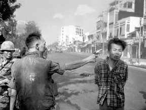 FILE - In this Feb. 1, 1968, file photo, South Vietnamese Gen. Nguyen Ngoc Loan, chief of the National Police, fires his pistol into the head of suspected Viet Cong officer Nguyen Van Lem (also known as Bay Lop) on a Saigon street, early in the Tet Offensive. Early on the morning of Jan. 31, 1968, as Vietnamese celebrated the Lunar New Year, or Tet as it is known locally, Communist forces launched a wave of coordinated surprise attacks across South Vietnam. The campaign, one of the largest of the Vietnam War, led to intense fighting and heavy casualties in cities and towns across the South.