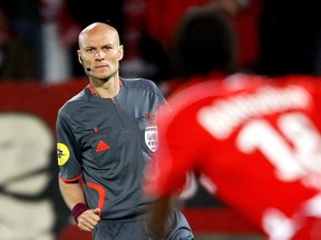 FILE - In this May 13, 2009, file photo, referee Tony Chapron is seen during their French League One soccer match between Bordeaux and Valenciennes at the Nungesser stadium in Valenciennes, northern France. French official Tony Chapron kicked out in retribution at Nantes defender Diego Carlos during a league game on Sunday, Jan, 14, 2018 and then promptly showed Carlos a red card.