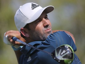 FILE - In this Nov. 18, 2017, file photo, Sergio Garcia from Spain tees off on the 2nd fairway during the third round of the DP World Tour Championship golf tournament in Dubai, United Arab Emirates. Masters champion Garcia made four early birdies to take the third-round lead at the Singapore Open on Sunday, Jan. 21, 2018, as organizers rushed to finish the tournament on time after three days of weather delays.