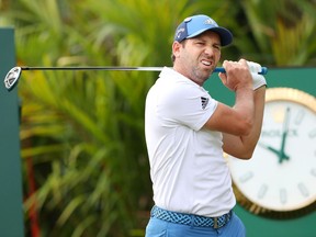 In this Wednesday, Jan. 17, 2018, photo, Spain's Sergio Garcia practices for the Singapore Open golf tournament in Singapore. Garcia kicked off his 2018 season in style on Thursday, Jan. 18, 2018, shooting a 5-under 66 to take a two-stroke lead after the first round of the Singapore Open. (Kyodo News via AP)